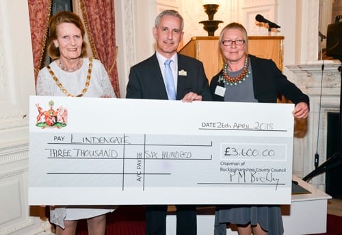 Patricia Birchley presents a cheque to representatives from Lindengate