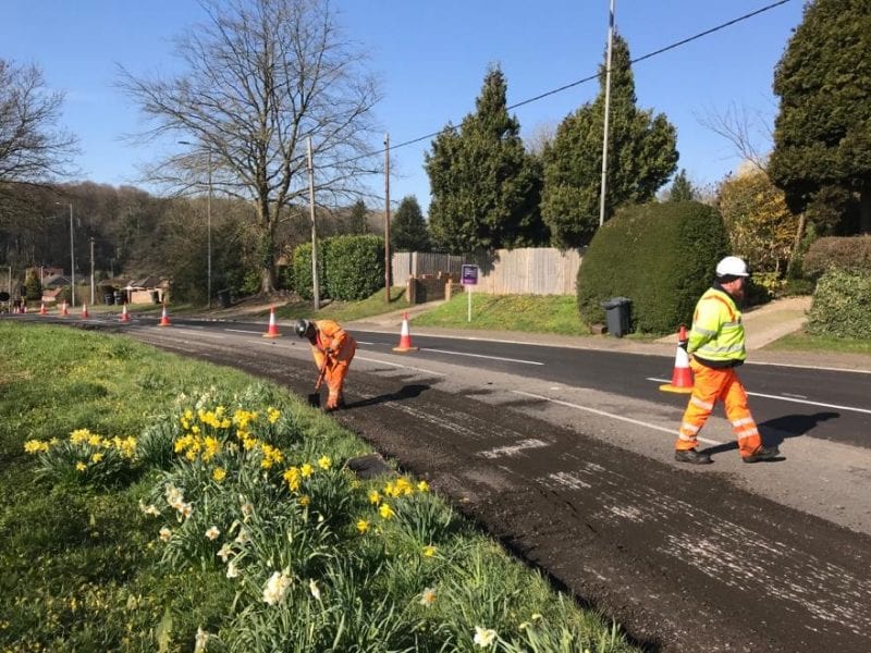 Planing and patching: working to social distancing rules, a crew tackles resurfacing in Amersham Road, Hazlemere