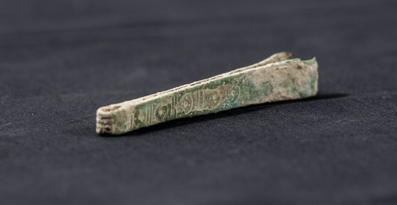 A pair of 5th or 6th century decorated copper alloy tweezers uncovered in a HS2 excavation in Wendover