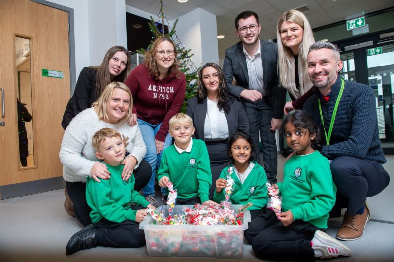 Front, pupils from Kingsbrook View Primary Academy with sweets bought with the donation from Vistry Group, with back, PTA members Rebecca Martin, Kayleigh Selleck and Melody O’Donnell, Vistry sales consultant Ree Naughton, area sales manager James Cole and marketing manager Alix Laflin, and school head teacher Jon Turner. 